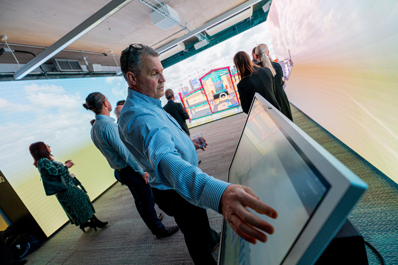 Staff member touching screen