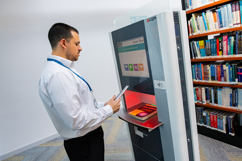 Staff member using touch screen